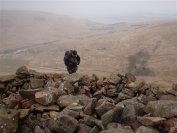 Robin nearing the main summit of Knockside