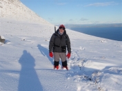 Peter up to his knees in the snow